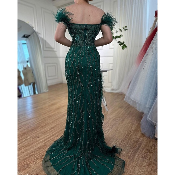 Emerald Off-the-shoulder mermaid dress with feather slit, sequins & short train. - Picture 4 of 5